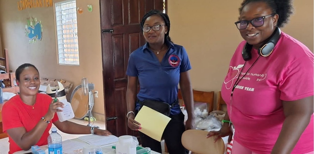 Hope for Humanity volunteers running a community health clinic in a kindergarten classroom